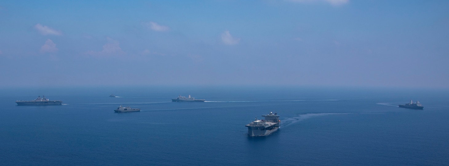 Amphibious assault ship USS Makin Island (LHD 8), amphibious transport docks USS Anchorage (LPD 23) and USS John P. Murtha (LPD 26), expeditionary mobile base USS Miguel Keith (ESB 5), and Philippine navy ships BRP Jose Rizal (FF-150), BRP Gregorio Del Pilar (PS 15), and BRP Tarlac (FF 601) transit the South China Sea for Balikatan 23, April 19, 2023. Balikatan is an annual exercise between the Armed Forces of the Philippines and U.S. military designed to strengthen bilateral interoperability, capabilities, trust, and cooperation built over decades of shared experiences. The Makin Island Amphibious Ready Group, comprised of Makin Island, Anchorage, and John P. Murtha, is operating in the U.S. 7th Fleet area of operations with the embarked 13th Marine Expeditionary Unit to enhance interoperability with Allies and partners and serve as a ready-response force to defend peace and maintain stability in the Indo-Pacific region. (U.S. Navy photo by Mass Communication Specialist 3rd Class Joshua Martinez)