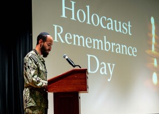 Lt. Levi Ceitlin delivers remarks during a Holocaust remembrance ceremony at Naval Support Activity Bahrain.