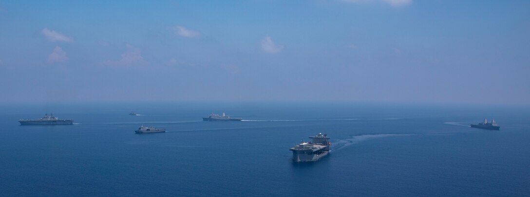 Amphibious assault ship USS Makin Island (LHD 8), amphibious transport docks USS Anchorage (LPD 23) and USS John P. Murtha (LPD 26), expeditionary mobile base USS Miguel Keith (ESB 5), and Philippine navy ships BRP Jose Rizal (FF-150), BRP Gregorio Del Pilar (PS 15), and BRP Tarlac (FF 601) transit the South China Sea for Balikatan 23, April 19, 2023. Balikatan is an annual exercise between the Armed Forces of the Philippines and U.S. military designed to strengthen bilateral interoperability, capabilities, trust, and cooperation built over decades of shared experiences. The Makin Island Amphibious Ready Group, comprised of Makin Island, Anchorage, and John P. Murtha, is operating in the U.S. 7th Fleet area of operations with the embarked 13th Marine Expeditionary Unit to enhance interoperability with Allies and partners and serve as a ready-response force to defend peace and maintain stability in the Indo-Pacific region. (U.S. Navy photo by Mass Communication Specialist 3rd Class Joshua Martinez)