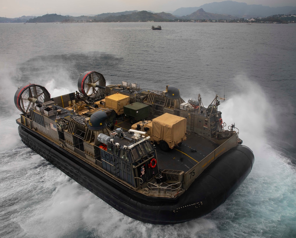 A U.S. Navy landing craft, air cushion, assigned to Assault Craft Unit 5, departs the well deck of amphibious assault ship USS Makin Island (LHD 8), during Balikatan 23, April 12, 2023 in the Subic Bay Harbor. Balikatan is an annual exercise between the Armed Forces of the Philippines and U.S. military designed to strengthen bilateral interoperability, capabilities, trust, and cooperation built over decades of shared experiences. The Makin Island Amphibious Ready Group, comprised of Makin Island and amphibious transport docks USS Anchorage (LPD 23) and USS John P. Murtha (LPD 26), is operating in the U.S. 7th Fleet area of operations with the embarked 13th Marine Expeditionary Unit to enhance interoperability with Allies and partners and serve as a ready-response force to defend peace and maintain stability in the Indo-Pacific region. (U.S. Navy photo by Mass Communication Specialist 3rd Class Eloise A. Johnson)