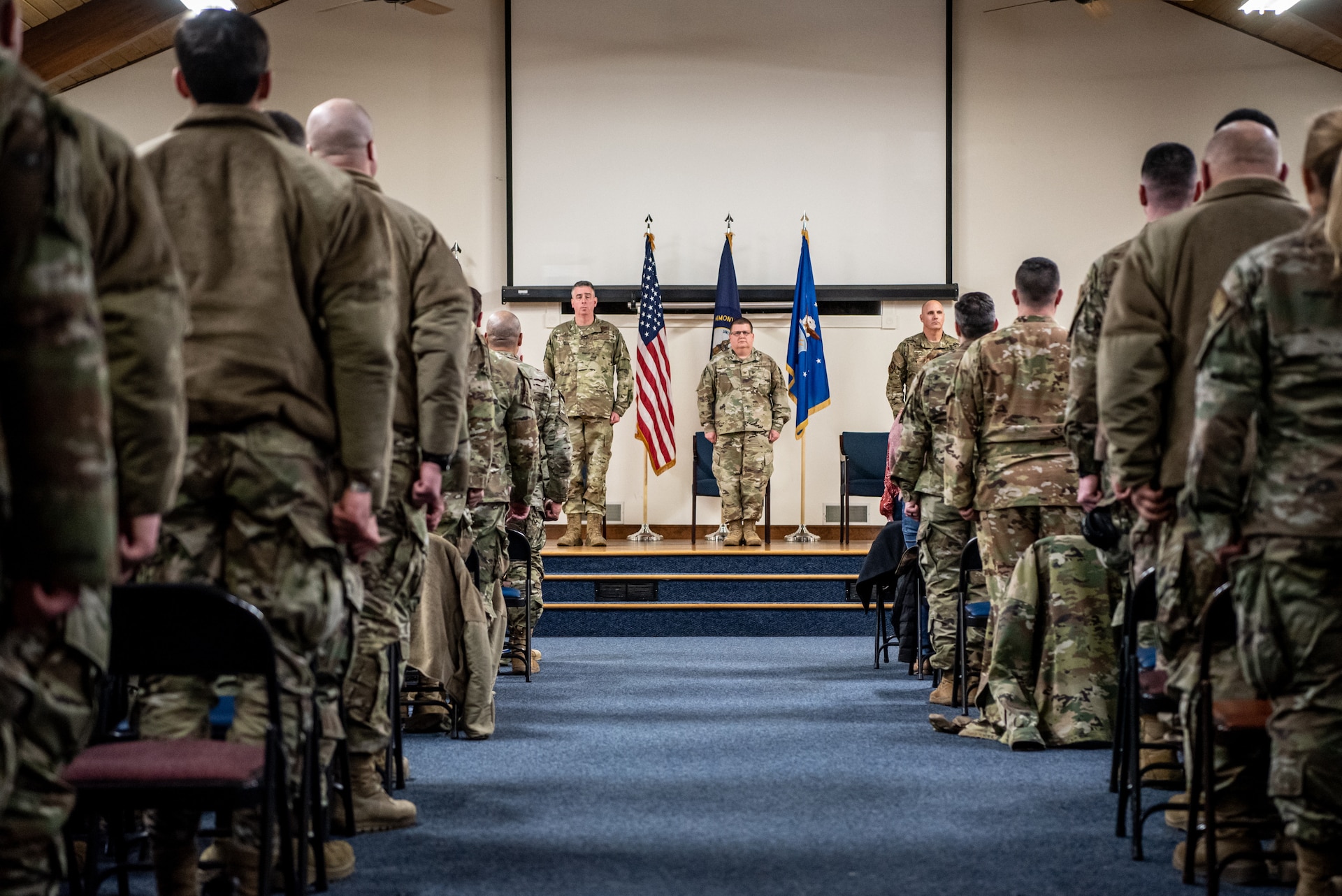 Col. Shawn Keller, center, incoming commander of the 123rd Mission Support Group, stands at attention after accepting the group's guidon during a change-of-command ceremony at the Kentucky Air National Guard Base in Louisville, Ky., Jan. 21, 2023. Keller is replacing Col. George Imorde, who is taking on the role of vice commander for the 123rd Airlift Wing. (U.S. Air National Guard photo by Tech. Sgt. Joshua Horton)
