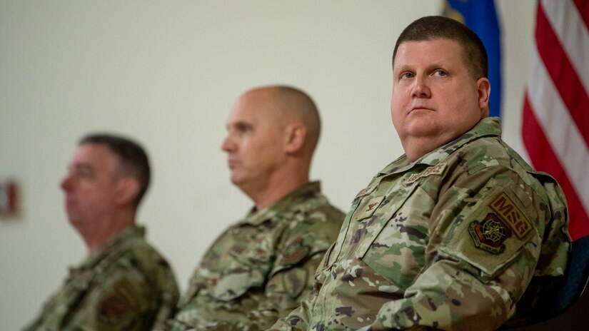 Col. Shawn Keller, right, incoming commander of the 123rd Mission Support Group, prepares to accept the group's guidon during a change-of-command ceremony at the Kentucky Air National Guard Base in Louisville, Ky., Jan. 21, 2023. Keller is replacing Col. George Imorde, center, who is taking on the role of vice commander for the 123rd Airlift Wing. (U.S. Air National Guard photo by Tech. Sgt. Joshua Horton)