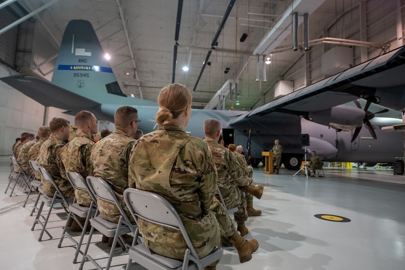 Col. Shawn Keller, right, incoming commander of the 123rd Mission Support Group, prepares to accept the group's guidon during a change-of-command ceremony at the Kentucky Air National Guard Base in Louisville, Ky., Jan. 21, 2023. Keller is replacing Col. George Imorde, center, who is taking on the role of vice commander for the 123rd Airlift Wing. (U.S. Air National Guard photo by Tech. Sgt. Joshua Horton)