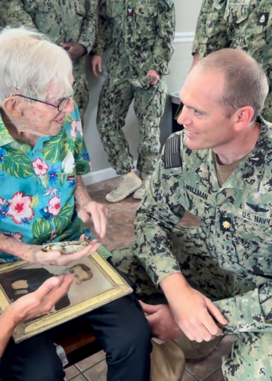 ST. LOUIS, Missouri (July 28, 2023) - World War II-Era Navy Machinist Mate 2nd Class William Hales (center) is photographed in celebration of his 100th birthday. Hales served in the United States Navy from 1942 to 1948. (U.S. Navy photo by Hospital Corpsman 2nd Class Jacob Decena)