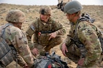 U.S. Army National Guard Infantrymen from Delta Company, 1st Battalion, 297th Infantry Regiment, perform tactical combat casualty care while conducting berm drills during training exercises in Lovell, Wyo., May 18, 2023.