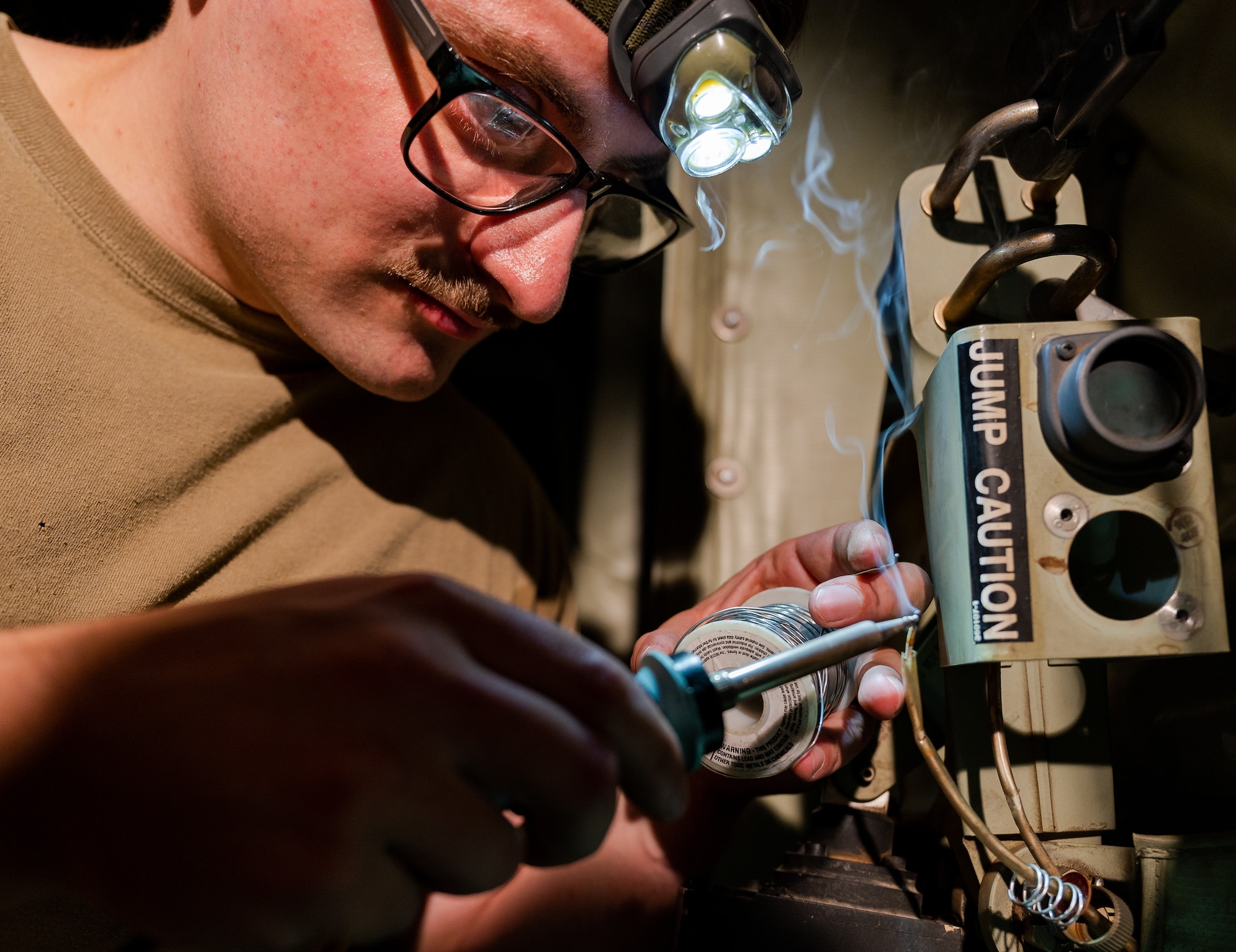 person welds wire