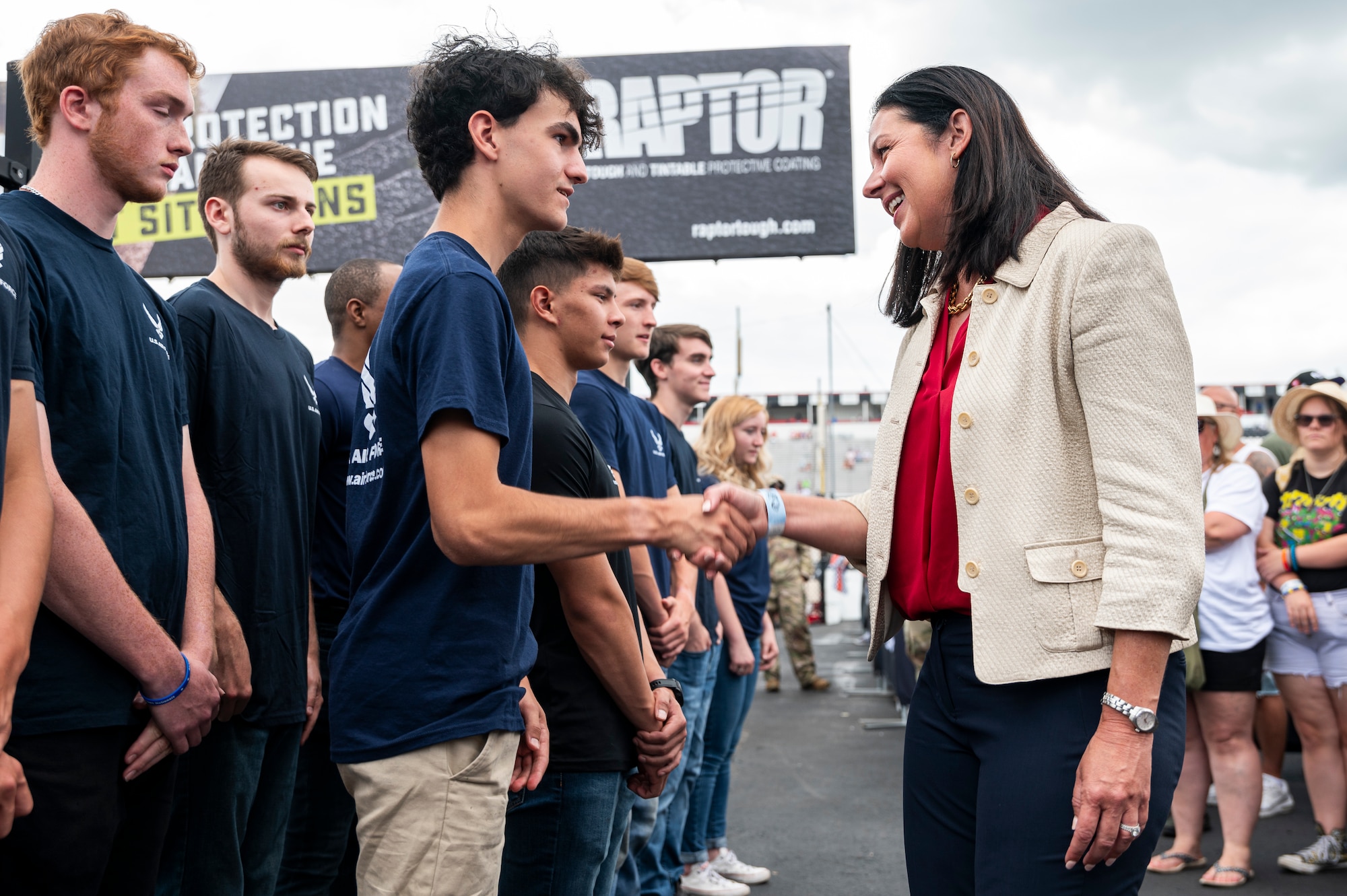 Kristyn Jones, assistant secretary of the Air Force for Financial Management and Comptroller, performing the duties of the under secretary of the Air Force, meets members of the Delayed Entry Program after delivering the oath of enlistment at Pocono Raceway, Pa., July 23, 2023. Jones visited the raceway to participate in the Air Force recruiting mission at the NASCAR Cup Series race as part of a longstanding partnership with Legacy Motor Club. (U.S. Air Force photo by Staff Sgt. Jacob B. Derry)