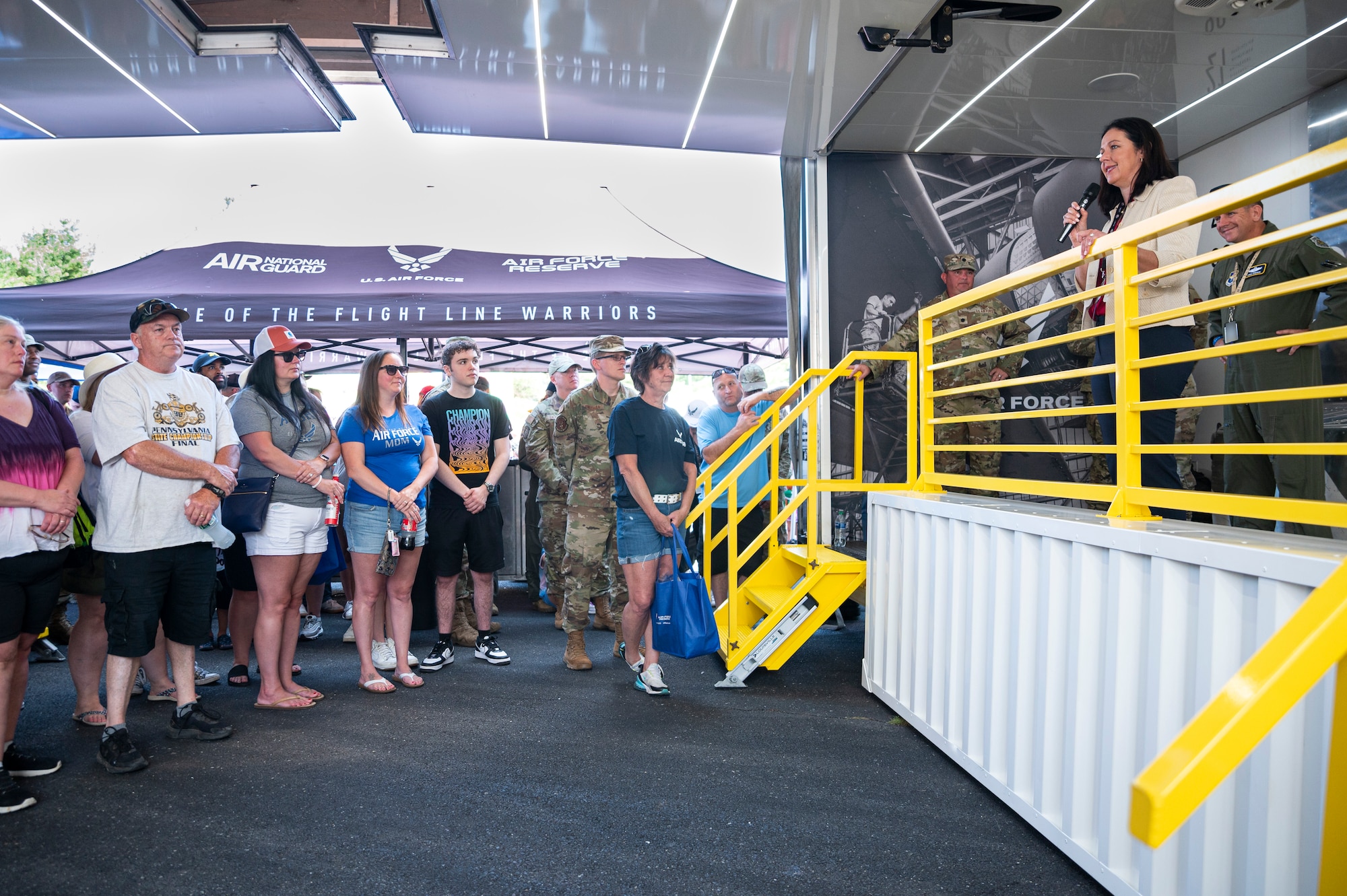 Kristyn Jones, assistant secretary of the Air Force for financial management and comptroller, performing the duties of the under secretary of the Air Force, speaks to Delayed Entry Program members and their families at Pocono Raceway, Pa., July 23, 2023. Jones visited the raceway to participate in the Air Force recruiting mission at the NASCAR Cup Series race as part of a longstanding partnership with Legacy Motor Club. (U.S. Air Force photo by Staff Sgt. Jacob B. Derry)