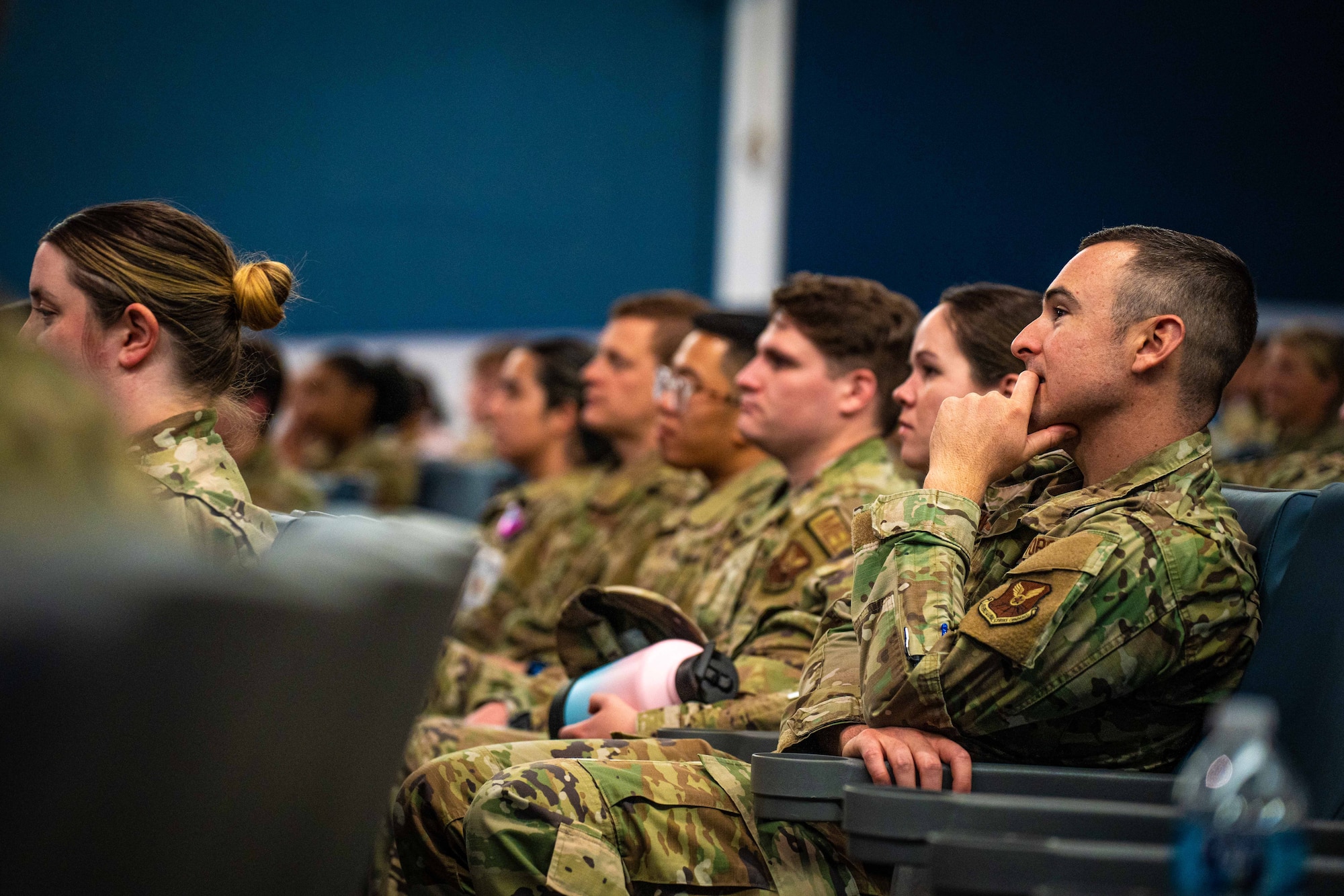 Crowd listens to commander