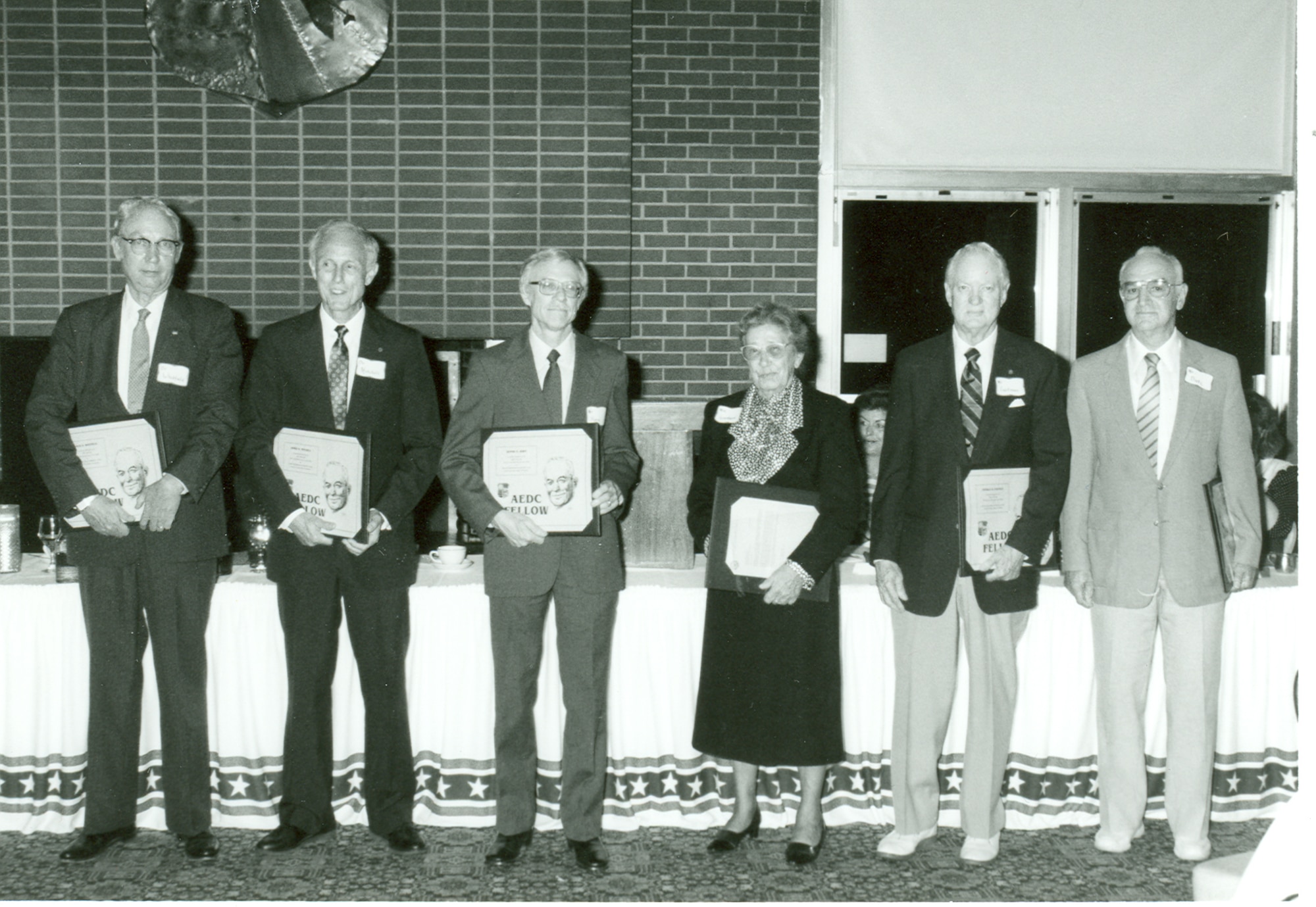 Dr. James Mitchell, second from left, is honored as an Arnold Engineering Development Complex Fellow in 1989. Mitchell was one of six scientists inducted in this inaugural Fellows class for his contributions to aerospace ground testing. Also pictured from left are Dr. Jack D. Whitfield, Dennis D. Horn, Hertha Goethert (on behalf of her late husband Dr. Bernhard H. Goethert), Donald R. Eastman and Robert O. Dietz. (U.S. Air Force photo)