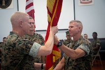 U.S. Marine Corps Gen. Eric Smith, the Assistant Commandant of the Marine Corps, delivers the unit colors to Maj. Gen. Paul J. Rock Jr., outgoing commander, during the U.S. Marine Corps Forces, Central Command, change of command ceremony at MacDill Air force Base, Florida, August 1, 2023. USMARCENT is designated as the Marine Corps service component for U.S. Central Command and is responsible for all Marine Corps forces in the CENTCOM area of responsibility.