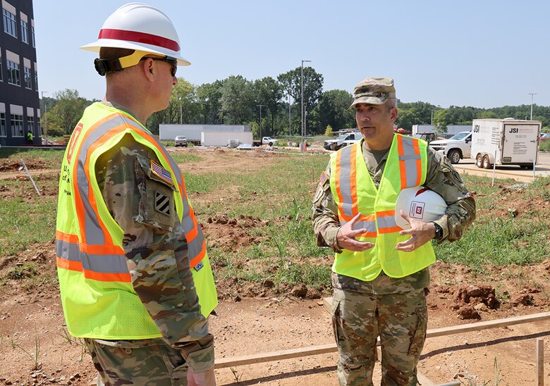 Col. Sebastian P. Joly, U.S. Army Corps of Engineers, Hunstville Engineering and Support Center commander, right, discusses his new building project with Brigadier Gen. Daniel Hibner, South Atlantic Division commander, on the site of the new Engineering and Support Center’ building on Redstone Arsenal, Huntsville, Ala., July 27, 2023. The new headquarters is being built utilizing the Enhanced Use Lease Program, an innovative way for USACE leaders to get projects completed. (U.S. Army photo by Chuck Walker)