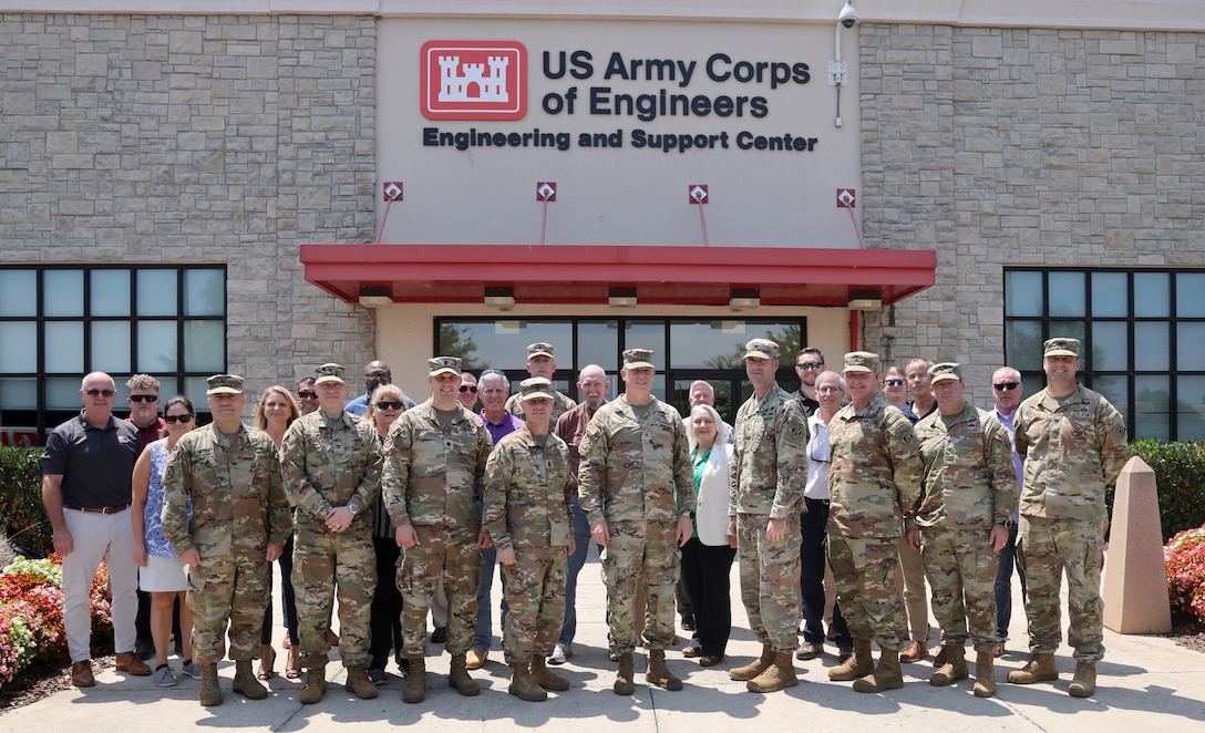 The attendees of the U.S. Army Corps of Engineers, South Atlantic Division fourth quarter FY 2023 Regional Governance Meeting pose for a group photo outside the Huntsville Engineering Support Center in Huntsville, Alabama, July 27, 2023. The four-day meeting provided the attendees the opportunity to present topics for decision to the SAD commander and offered site visits to the various projects around Redstone Arsenal. (U.S. Army photo by Chuck Walker)