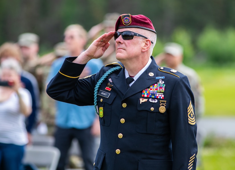Command Sgt. Maj. Michael Grunst salutes the U.S. flag during his retirement ceremony July 21, 2023, at Camp Carroll on Joint Base Elmendorf-Richardson. Grunst joined the Alaska Army National Guard in 1989 and finished his 34-year career as the G3 operations sergeant major for the AKARNG.