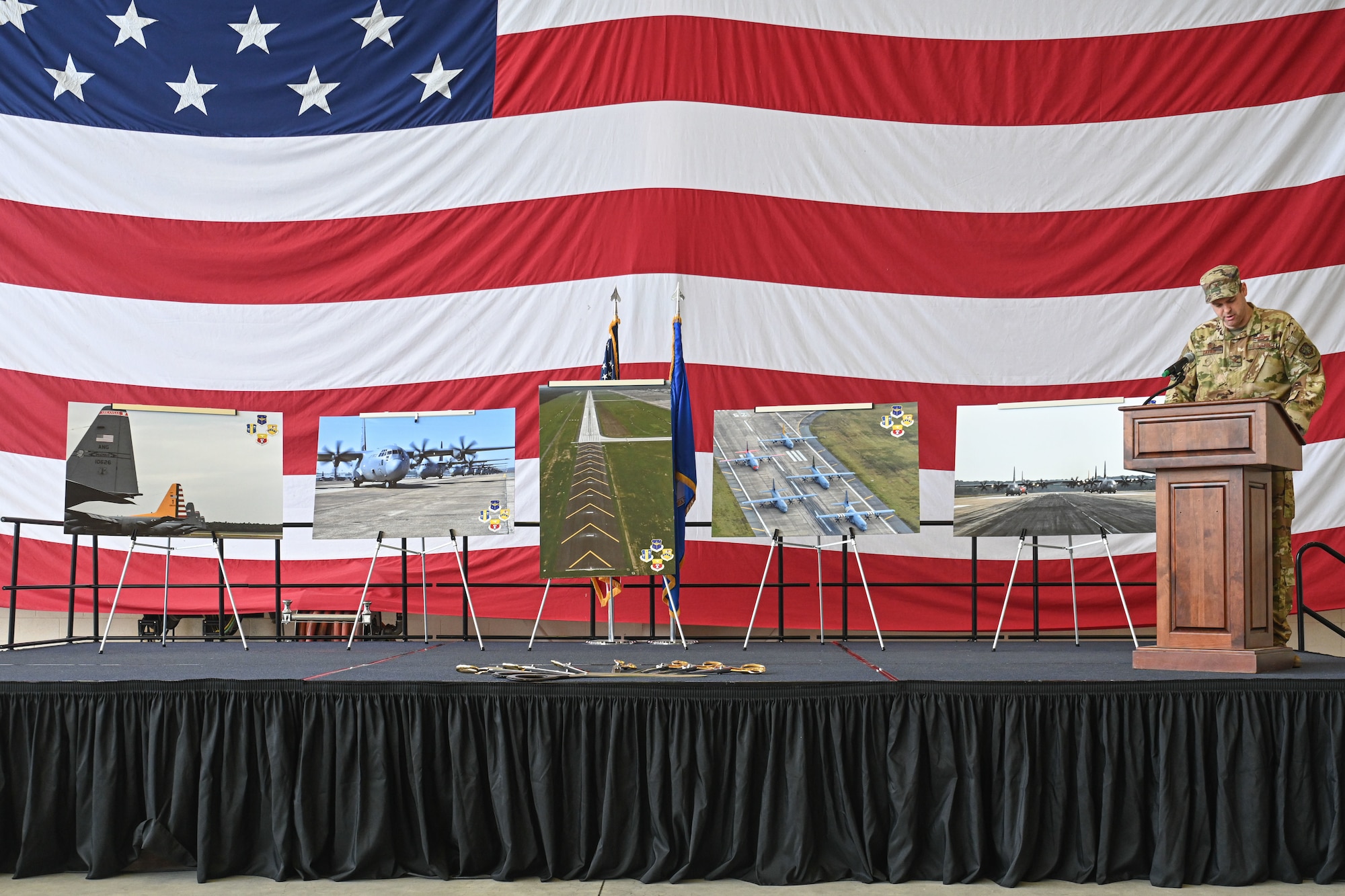 Col. Davies speaks at a podium.