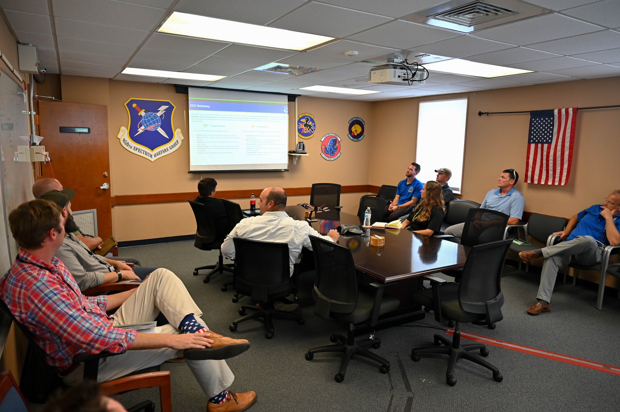Civilian members of the 350th Spectrum Warfare Wing attend the initial meeting of the Civilian Crow College at Eglin Air Force Base, Fla., Aug. 1, 2023. Civilian Crow College is the wing's first professional development course aimed at its civilian members and is focused on developing them as future leaders with an electronic warfare backdrop. (U.S. Air Force photo by Capt. Benjamin Aronson)