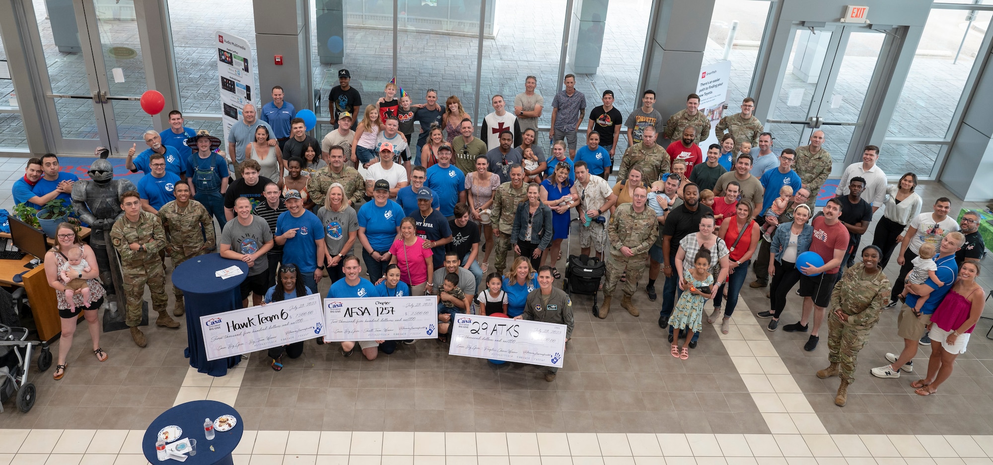 Volunteers with the 2023 Casa’s Big Give pose for a photo during the closing ceremony at Casa Auto Group, Alamogordo, New Mexico, July 23, 2023. This was the 13th year of the Big Give, an annual event supported by businesses in the local Otero County community funding for community improvement projects. (U.S. Air Force photo by Airman 1st Class Michelle Ferrari)