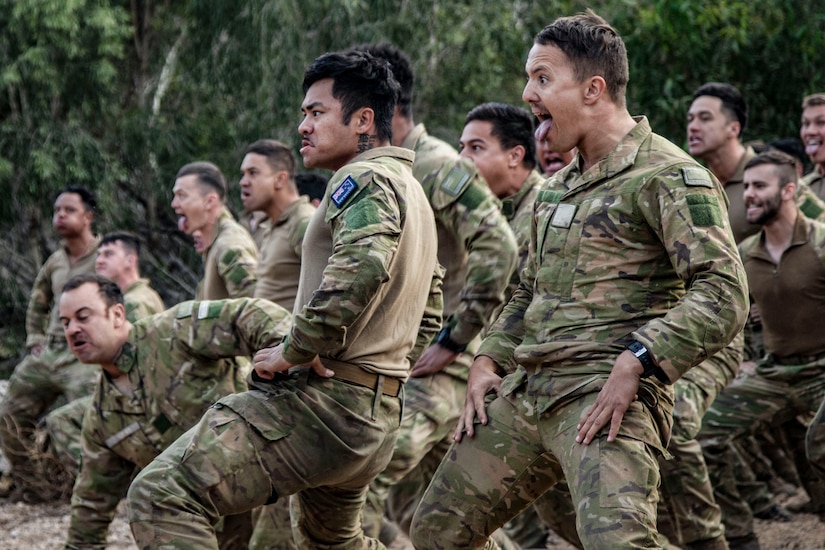 Soldiers from the New Zealand Army perform the haka to mark the beginning of Talisman Sabre 23 in Townsville Field Training Area, Australia, July 21, 2023. The New Zealand and Australian army units performed a traditional war ritual following a group photo of partner nations assigned to Battle Group Ram for the exercise.Talisman Sabre is the largest bilateral military exercise between Australia and the United States advancing a free and open Indo-Pacific by strengthening relationships and interoperability among key Allies and enhancing our collective capabilities to respond to a wide array of potential security concerns. (U.S. Army photo by Sgt. Jason Greaves)