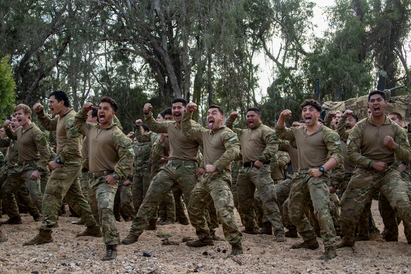 Soldiers from the New Zealand Army perform the haka to mark the beginning of Talisman Sabre 23 in Townsville Field Training Area, Australia, July 21, 2023. The New Zealand and Australian army units performed a traditional war ritual following a group photo of partner nations assigned to Battle Group Ram for the exercise.Talisman Sabre is the largest bilateral military exercise between Australia and the United States advancing a free and open Indo-Pacific by strengthening relationships and interoperability among key Allies and enhancing our collective capabilities to respond to a wide array of potential security concerns. (U.S. Army photo by Sgt. Jason Greaves)