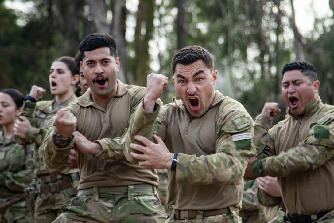 Soldiers from the New Zealand Army perform the haka to mark the beginning of Talisman Sabre 23 in Townsville Field Training Area, Australia, July 21, 2023. The New Zealand and Australian army units performed a traditional war ritual following a group photo of partner nations assigned to Battle Group Ram for the exercise.Talisman Sabre is the largest bilateral military exercise between Australia and the United States advancing a free and open Indo-Pacific by strengthening relationships and interoperability among key Allies and enhancing our collective capabilities to respond to a wide array of potential security concerns. (U.S. Army photo by Sgt. Jason Greaves)