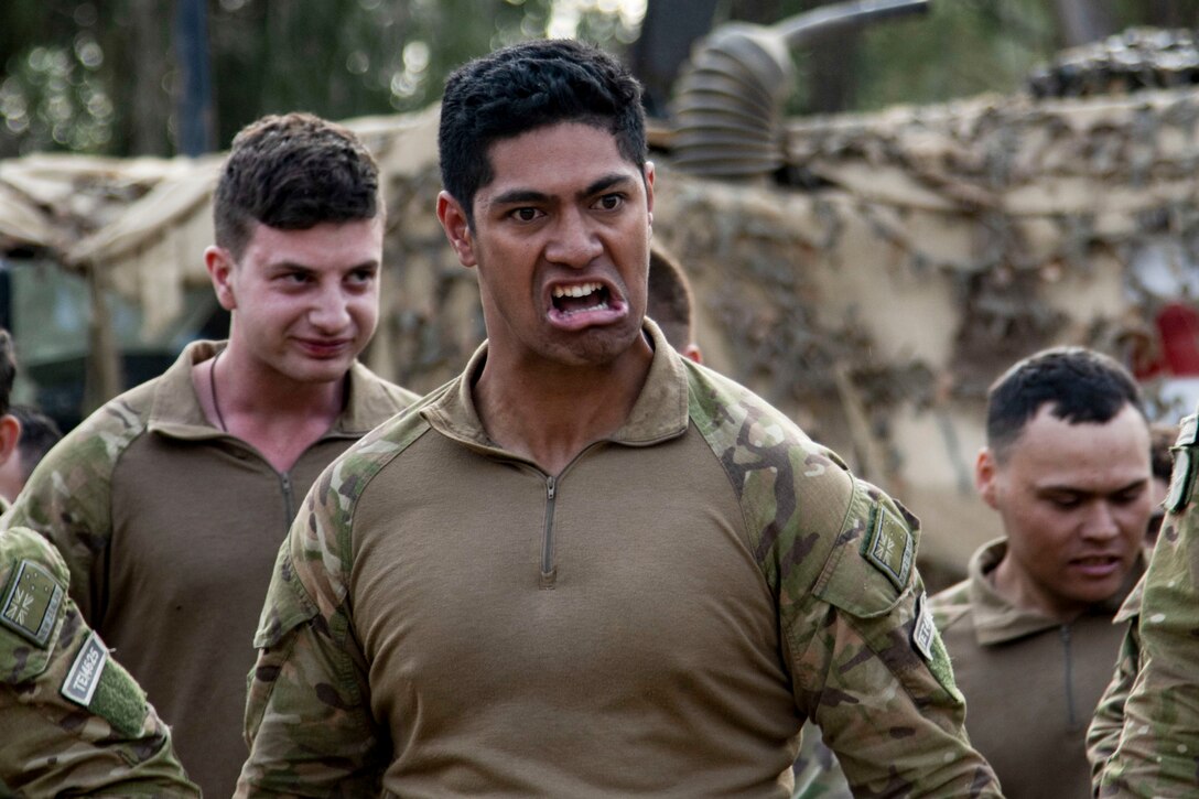 Soldiers from the New Zealand Army perform the haka to mark the beginning of Talisman Sabre 23 in Townsville Field Training Area, Australia, July 21, 2023. The New Zealand and Australian army units performed a traditional war ritual following a group photo of partner nations assigned to Battle Group Ram for the exercise.Talisman Sabre is the largest bilateral military exercise between Australia and the United States advancing a free and open Indo-Pacific by strengthening relationships and interoperability among key Allies and enhancing our collective capabilities to respond to a wide array of potential security concerns. (U.S. Army photo by Sgt. Jason Greaves)
