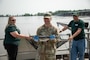 USACE Rock Island District Commander, Col. Jesse Curry, holds a paddlefish during a fish tagging event at Lock and Dam 22 in Hannibal, Missouri.