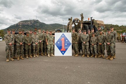 U.S. Navy Adm. John C. Aquilino, center left, the commander of U.S. Indo-Pacific Command, and U.S. Marines with 1st Marine Division pose for a photo during Exercise Talisman Sabre 23 at Lavarack Barracks in Townsville, Australia, July 30, 2023. Talisman Sabre is the largest bilateral military exercise between Australia and the United States advancing a free and open Indo-Pacific by strengthening relationships and interoperability among key Allies and enhancing our collective capabilities to respond to a wide array of potential security concerns. (U.S. Marine Corps photo by Cpl. Emeline Molla)