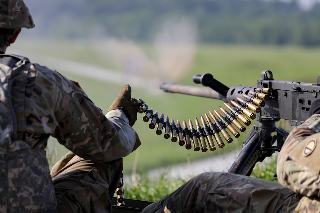 A U.S. Army Reserve Soldier assigned to the 3-411th Logistic Support Battalion, Camp Atterbury, Indiana fires 50-caliber machine gun rounds at a target during Operation Pershing Strike at Camp Atterbury, Indiana.
