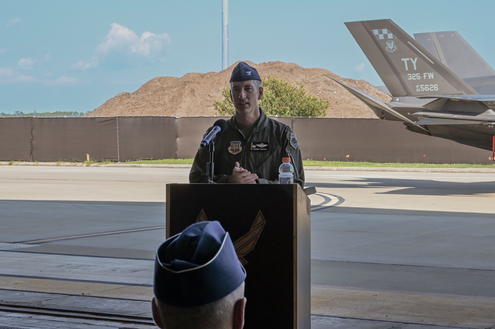 Man speaks at podium