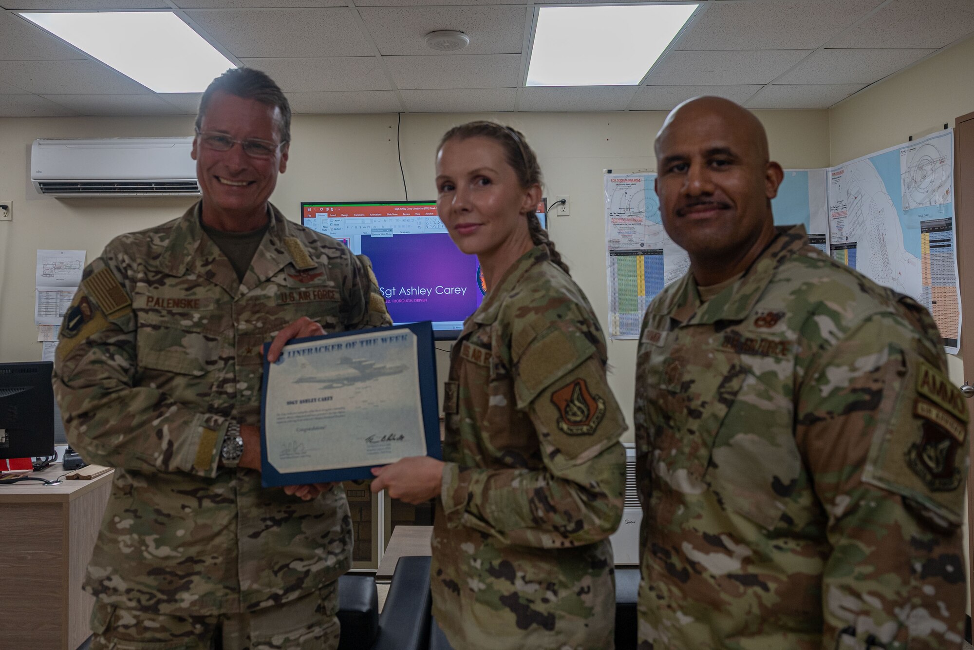 Photo of an Airman receiving the Linebacker of the Week award