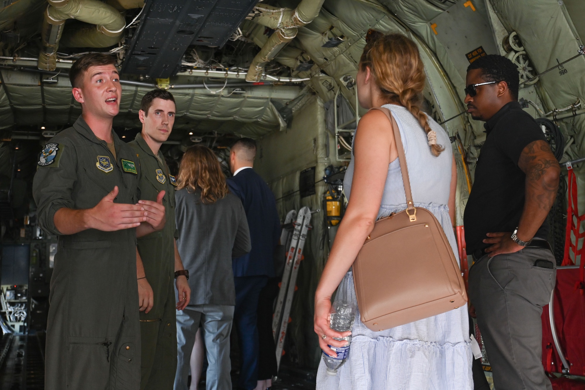 People tour the inside of an aircraft.