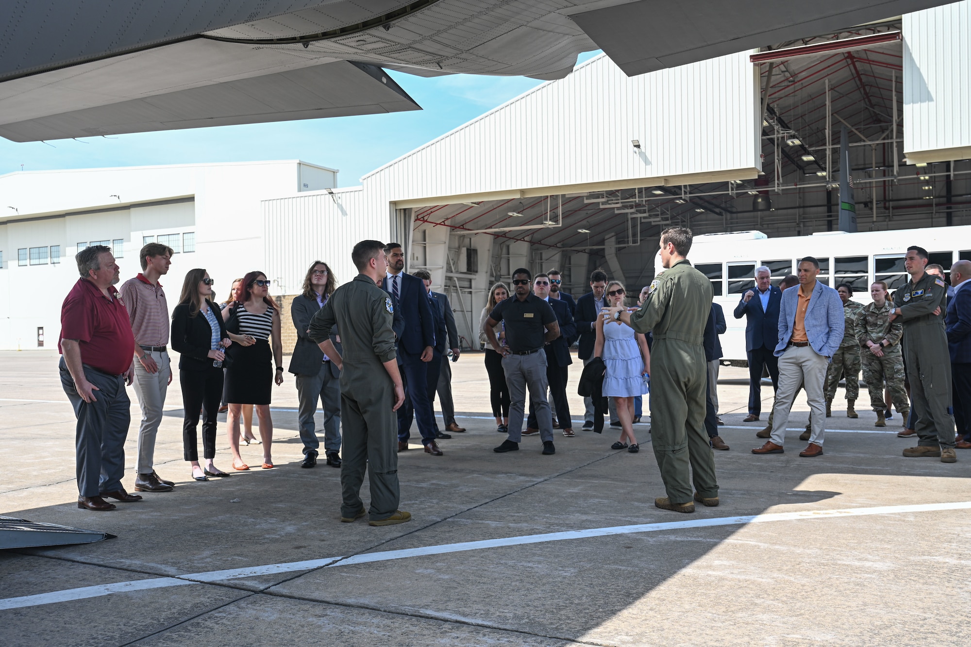 People tour a C-130 aircraft.