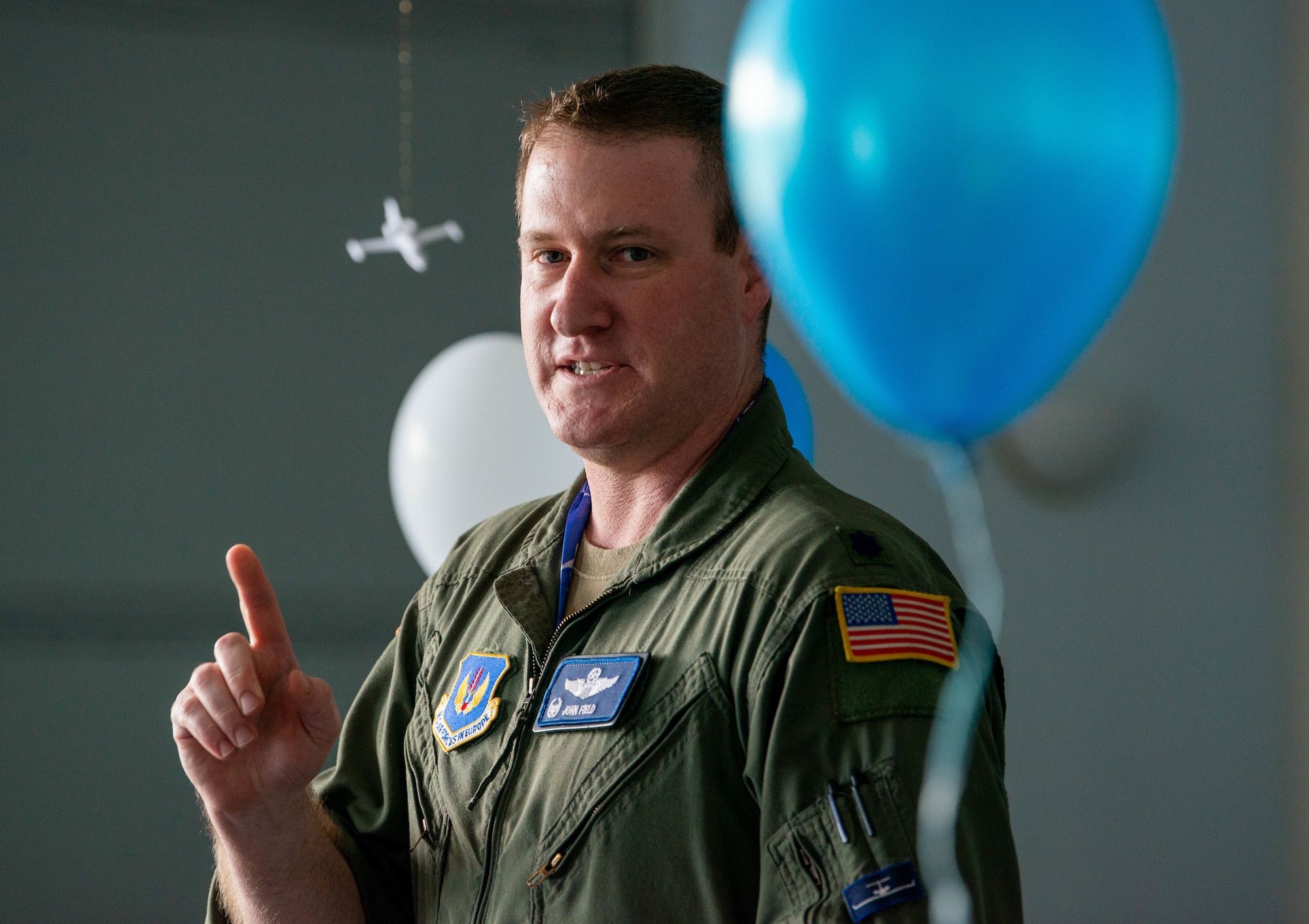 The 76th Airlift Squadron commander speaks at a family event