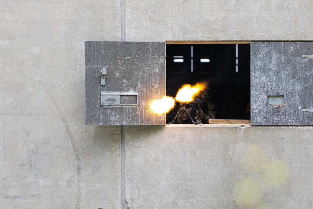 A weapon is fired from a window during a training exercise.