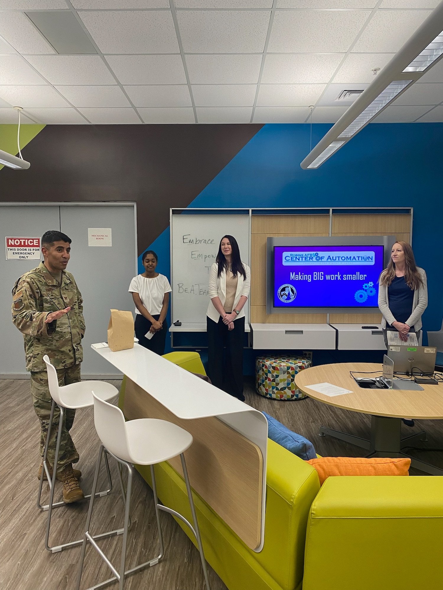 People standing up doing a presentation