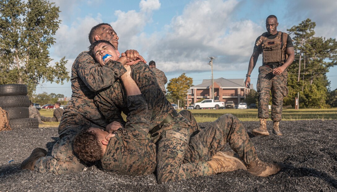 U.S. Marines participate in a culminating event during a Marine Corps Martial Arts Instructor (MAI) Course on Camp Lejeune, North Carolina, July 27, 2023. MAI Courses are designed to develop the individual Marine’s understanding of combative techniques while enduring both mental and physical stressors. (U.S. Marine Corps photo by Cpl. Megan Ozaki)