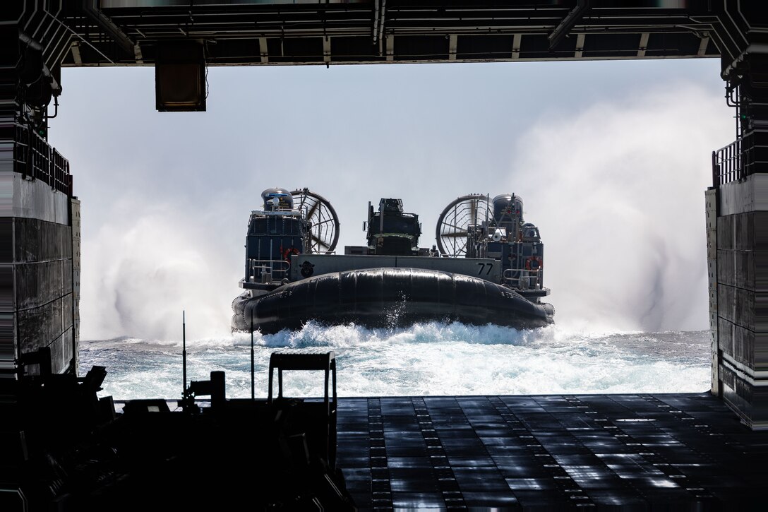 A U.S. Navy LCAC enters the well deck of the San Antonio class amphibious transport docking ship USS Mesa Verde (LPD 19) on the Atlantic Ocean, July 25, 2023. The USS Mesa Verde (LPD-19), assigned to the Bataan Amphibious Ready Group and embarked 26th Marine Expeditionary Unit (Special Operations Capable), under the command and control of Task Force 61/2, is on a scheduled deployment in the U.S. Naval Forces Europe area of operations, employed by U.S. Sixth Fleet to defend U.S., allied and partner interests. (U.S. Marine Corps photo by Cpl. Michele Clarke)