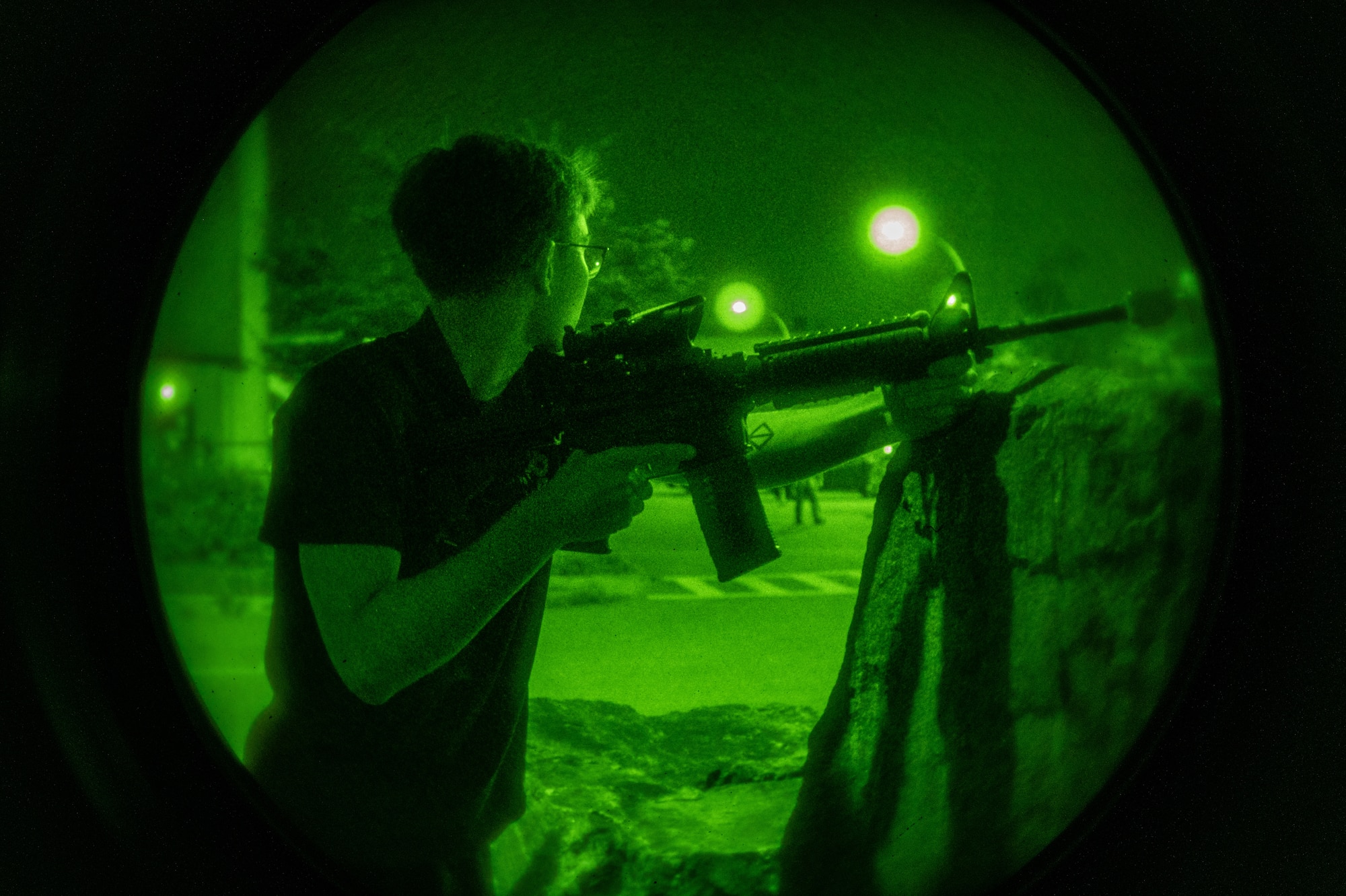 A U.S. Air Force Defender from the 51st Security Forces Squadron role plays as opposing forces (OPFOR) during a simulated ground attack at Osan AB, Republic of Korea, Aug. 1, 2023. As part of a routine training event, OPFOR units replicate the tactics, strategies, and capabilities of potential adversaries or opposing military forces. They engage in mock combat scenarios to challenge and test the skills, readiness, and effectiveness of friendly forces. (U.S. Air Force photo by Senior Airman Thomas Sjoberg)
