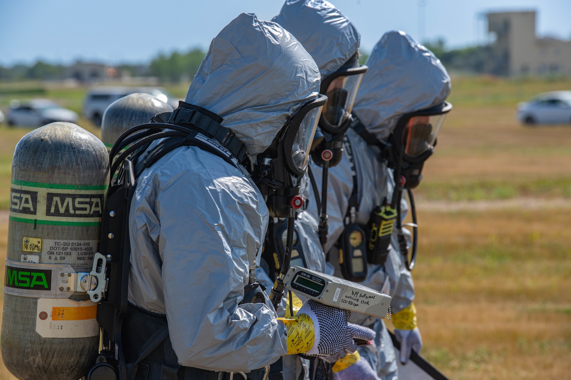 U.S. Airmen, assigned to the 5th Civil Engineer Squadron explosive ordnance disposal (EOD) flight, survey an area for ordnance during a readiness exercise at Minot Air Force Base, North Dakota, July 27, 2023. EOD utilizes specialized techniques to remove hazards created by explosive ordnance. (U.S. Air Force photo by Airman 1st Class Kyle Wilson)