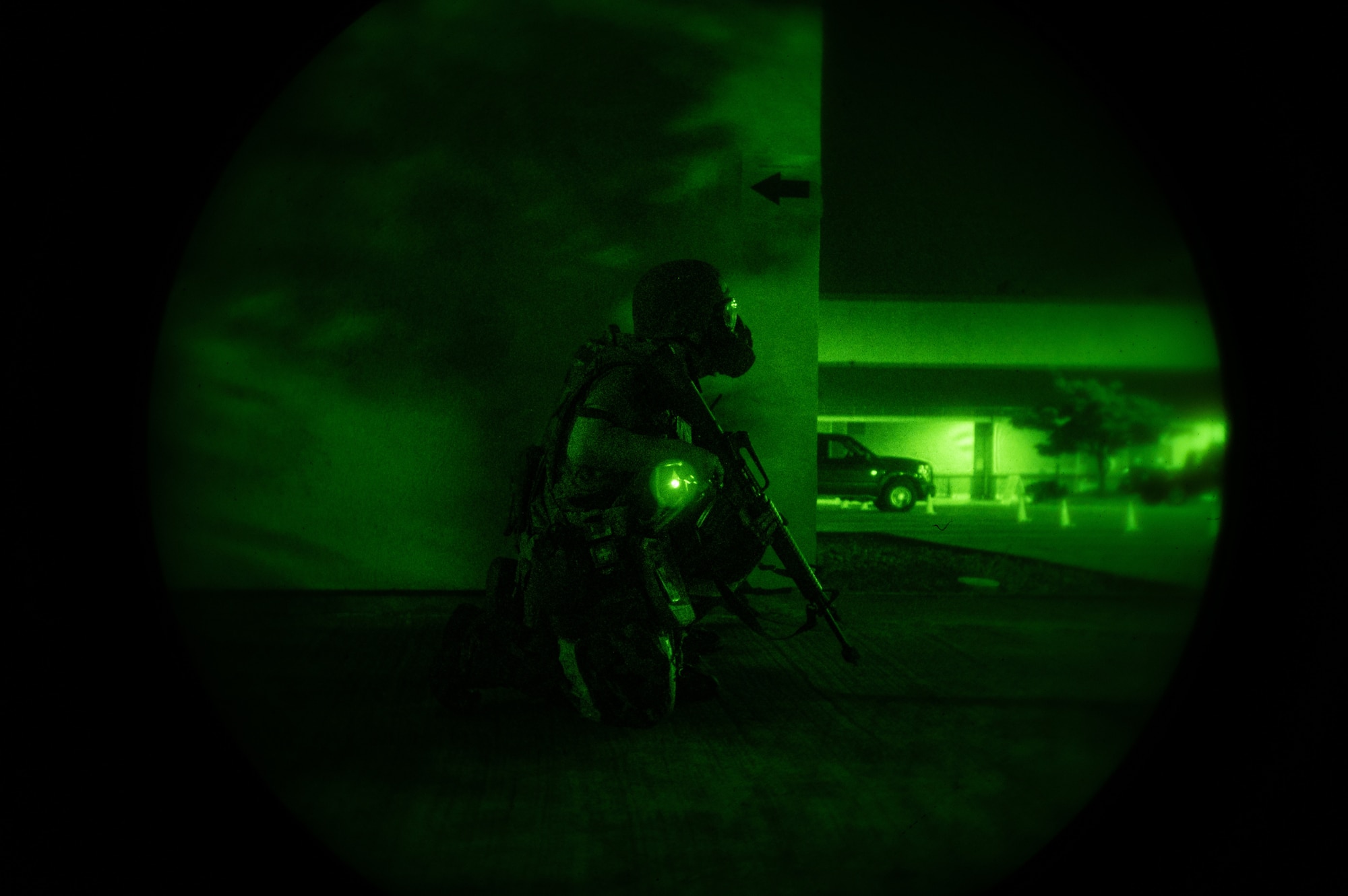 A U.S. Air Force Airmen from the 51st Communications Squadron, scans the area for opposing forces during a simulated ground attack at Osan Air Base, Republic of Korea, Aug. 1, 2023. By conducting simulated ground attacks, Osan AB fosters a culture of continuous improvement, empowering Airmen to adapt and excel in challenging ground-based scenarios. (U.S. Air Force photo by Staff Sgt. Thomas Sjoberg)