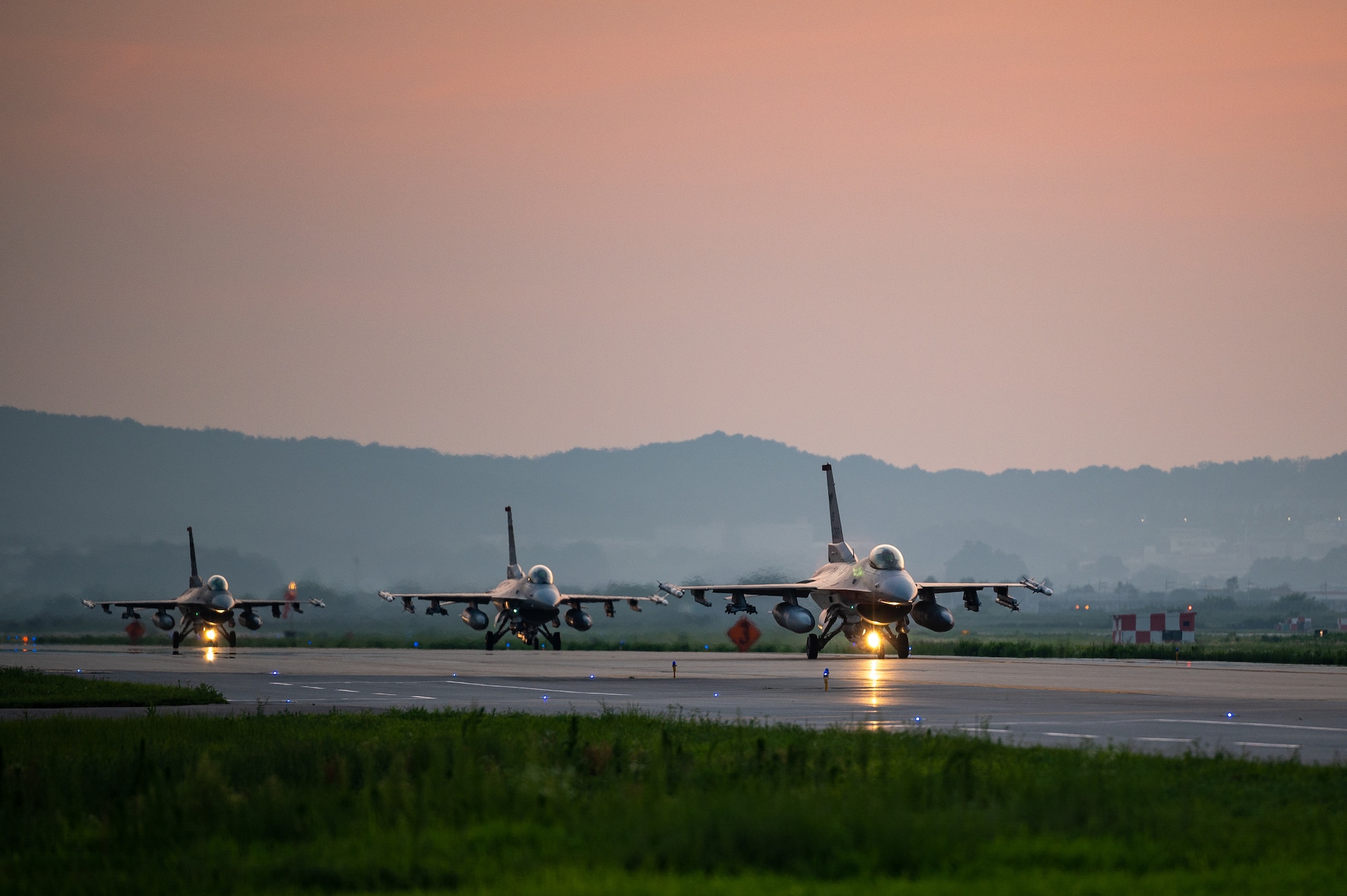 U.S. Air Force F-16 Fighting Falcon’s assigned to the 51st Fighter Wing, taxi down an Alternate Landing Surface at Osan AB, Republic of Korea, Aug. 1, 2023. The F-16, a highly versatile and agile multi-role fighter aircraft, is renowned for its exceptional performance and capabilities. Throughout the training event, the ALS allowed the aircraft to deploy while simulating a partially damaged runway. (U.S. Air Force photo by Staff Sgt. Thomas Sjoberg)