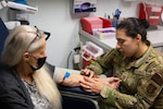 U.S. Air Force Capt. Jessica Alves, a medical specialist assigned to the 109th Airlift Wing, New York Air National Guard, works with a patient during an Innovative Readiness Training mission in Covelo, California, June 16, 2023. IRT missions offer no-cost medical care to U.S. communities while providing hands-on experience to service members.