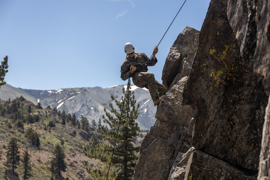 U.S. Navy Hospitalman 2nd Class Nicholas Mclellan, a student with Mountain Medicine 1-23, practices rappelling during MMED at Marine Corps Mountain Warfare Training Center, Bridgeport, California, July 23, 2023. MMED challenges service members with various medical and technical problems common to mountainous environments in preparation for future conflicts in austere terrain.