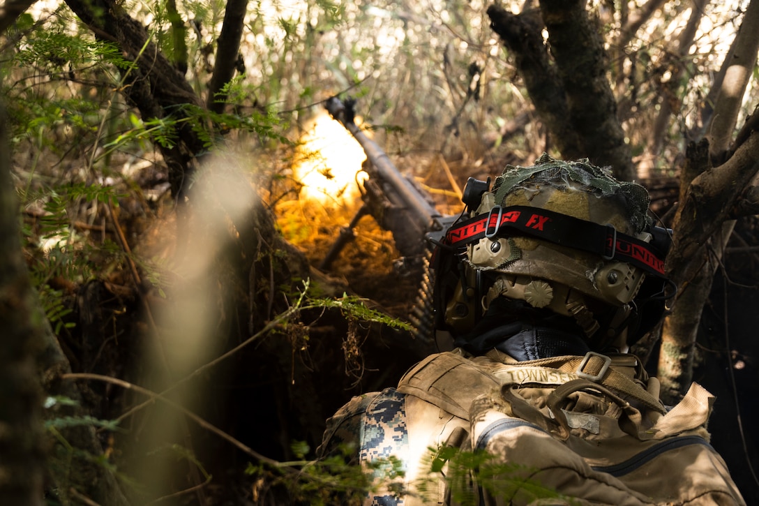 U.S. Marine Corps Cpl. Jack Townsend, a student in the Advanced Infantry Marine Course with Advanced Infantry Training Battalion, School of Infantry-West, Hawaii Detachment, provides suppressive fire during urban operations training, Marine Corps Training Area Bellows, July 11, 2023. The training was conducted as part of the Advanced Infantry Marine Course. AIMC is designed to enhance and test Marines’ skills with a focus on reinforcing proper patrols and operational procedures.