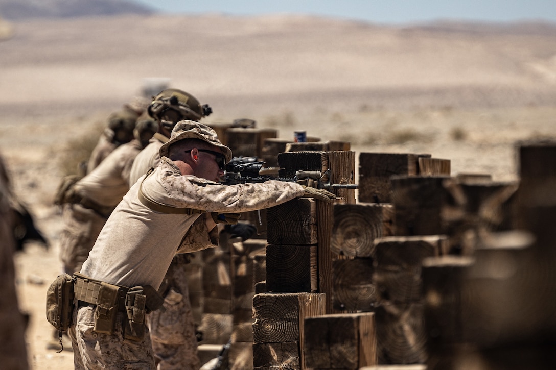 A U.S. Marine with 2d Battalion, 8th Marines, 2d Marine Regiment, 2d Marine Division zero’s his rifle during a live fire range as a part of a Service Level Training Exercise (SLTE) on Marine Corps Air-Ground Combat Center, Twentynine Palms, California, July 21, 2023. The SLTE is a series of exercises designed to prepare Marines for future operations around the globe and to enhance the combat readiness for all elements of the Marine Air Ground Task Force. (U.S. Marine Corps photo by Lance. Joshua Kumakaw)