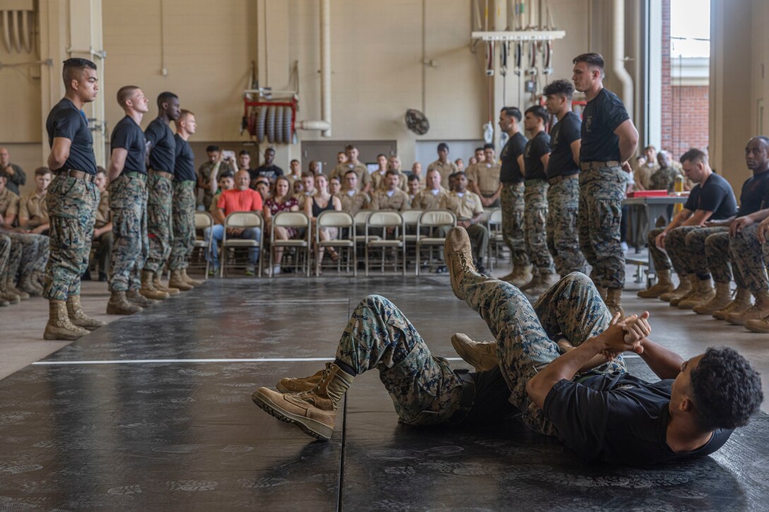 U.S. Marines conduct a demonstration during a Marine Corps Martial Arts instructor (MAI) Course graduation on Camp Lejeune, North Carolina, July 28, 2023. MAI Courses are designed to develop the individual Marine’s understanding of combative techniques while enduring both mental and physical stressors. (U.S. Marine Corps photo by Cpl. Megan Ozaki)