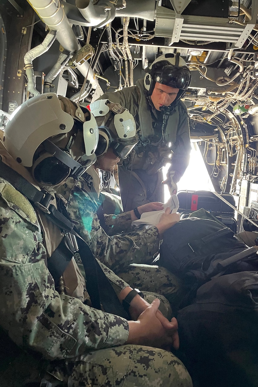 Marines chatter inside an aircraft.