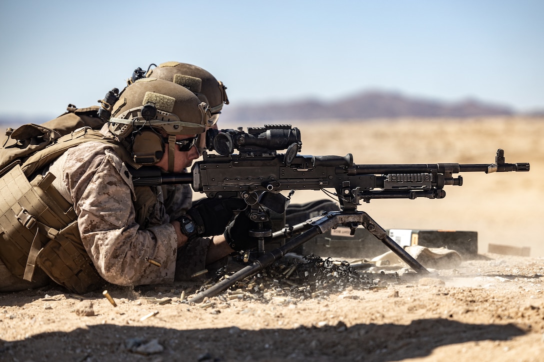 U.S. Marine Corps Sgt. Matthew Moss, a combined anti armor and a team section leader with 2d Battalion, 8th Marines, 2d Marine Regiment, 2d Marine Division, fires an M240B machine gun during a live fire range as a part of a Service Level Training Exercise (SLTE) on Marine Corps Air-Ground Combat Center, Twentynine Palms, California, July 21, 2023. The SLTE is a series of exercises designed to prepare Marines for future operations around the globe and to enhance the combat readiness for all elements of the Marine Air Ground Task Force. (U.S. Marine Corps photo by Lance. Joshua Kumakaw)