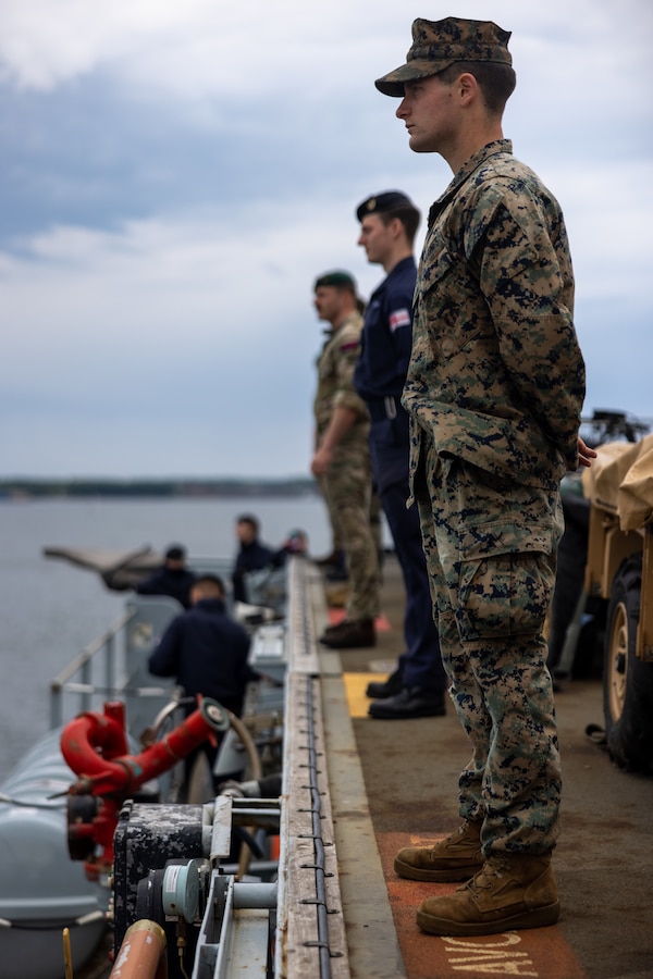 U.S. Marine Corps Lance Cpl. Alex Marquez, a Wilkes-Barre, Pennsylvania native, and rifleman with Golf Company, 2d Battalion, 6th Marine Regiment, 2d Marine Division, mans the rails while pulling into port during exercise Baltic Operations 2023 (BALTOPS 23) in Kiel, Germany, June 15, 2023. BALTOPS 23 is the premier maritime-focused exercise in the Baltic region. The exercise led by U.S. Naval Forces Europe-Africa and executed by Naval Striking and Support Forces NATO provides a unique training opportunity to strengthen the combined response capability critical to preserving the freedom of navigation and security in the Baltic Sea. (U.S. Marine Corps photo by Lance Cpl. Ryan Ramsammy)