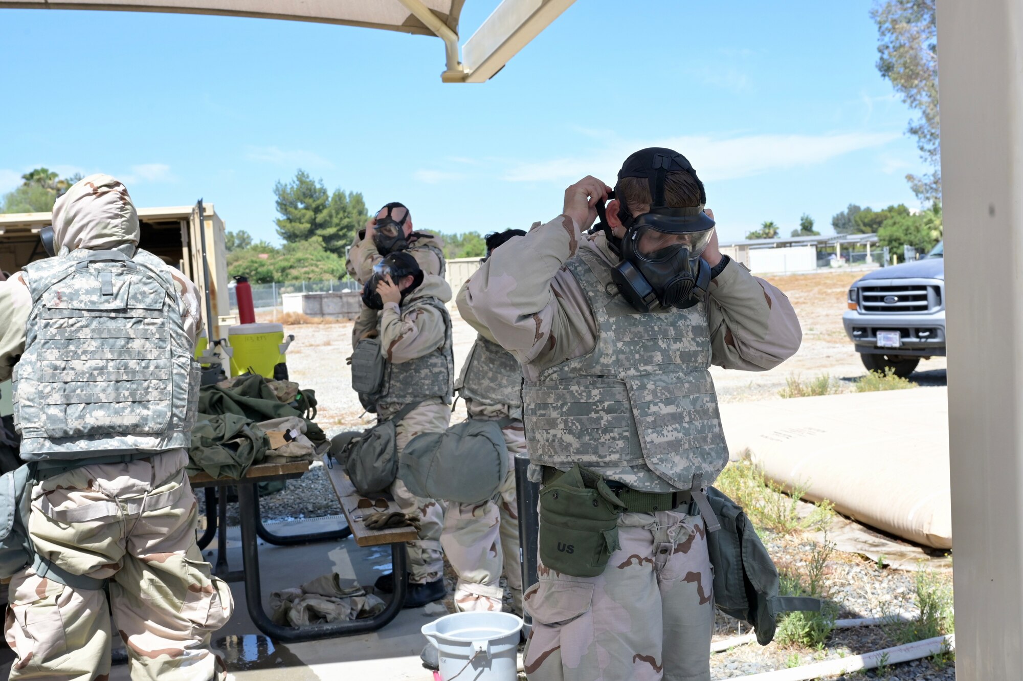 Members of the Reverse Osmosis Water Purification Unit transition to MOPP 4 during their exercise at March Air Reserve Base.
